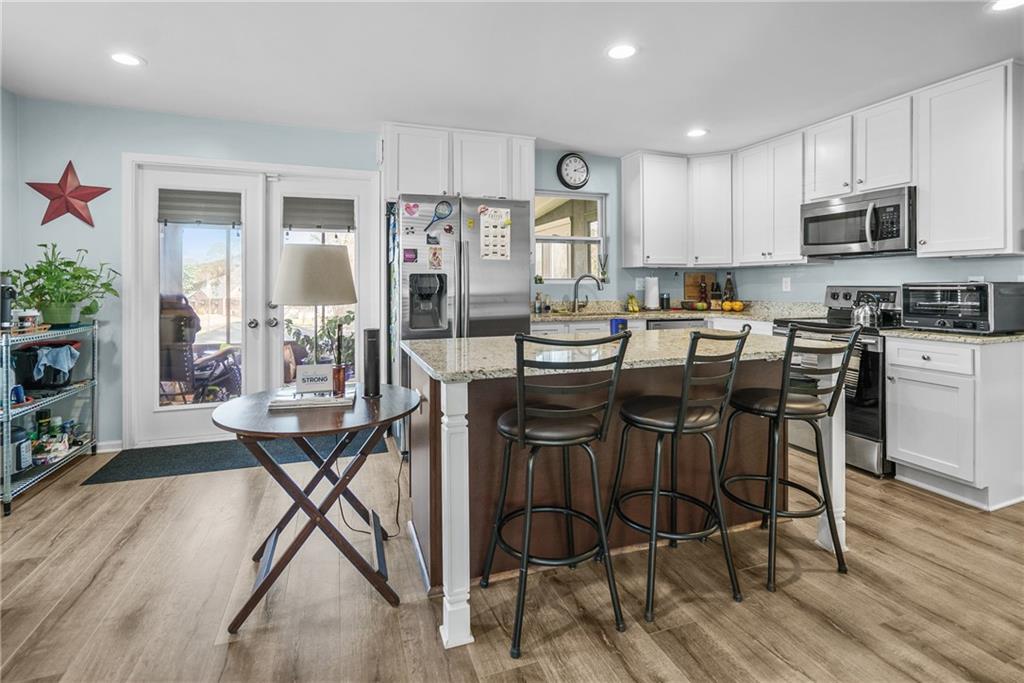 2444 Constance Street Atlanta, GA 30344 - Photo 16 of 39 a view of a dining room with furniture and wooden floor