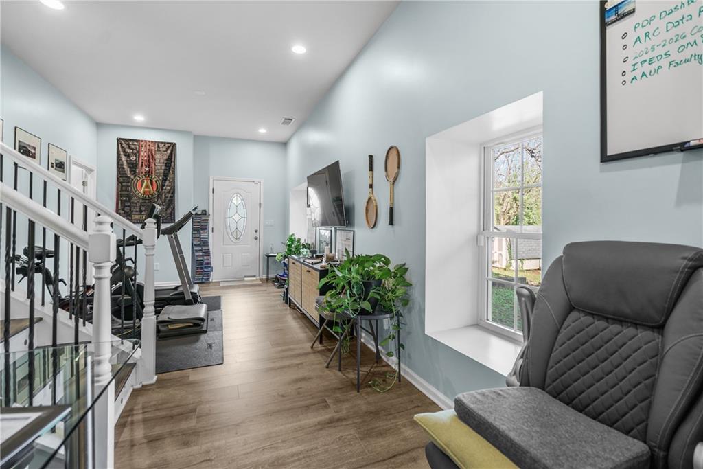 2444 Constance Street Atlanta, GA 30344 - Photo 20 of 39 a living room with furniture and a wooden floor