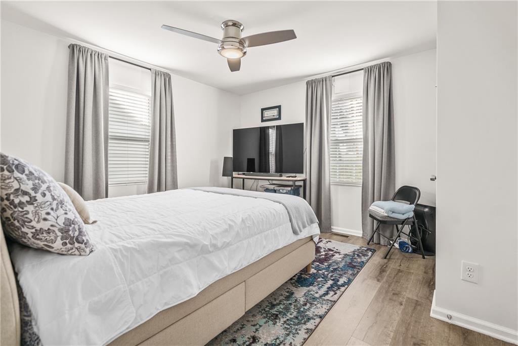 2444 Constance Street Atlanta, GA 30344 - Photo 27 of 39 a bedroom with a bed and wooden floor