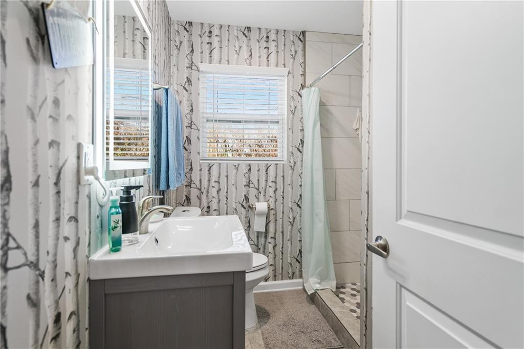 2444 Constance Street Atlanta, GA 30344 - Photo 30 of 39 a bathroom with a sink and a mirror