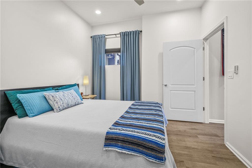 2444 Constance Street Atlanta, GA 30344 - Photo 31 of 39 a bedroom with a bed and wooden floor