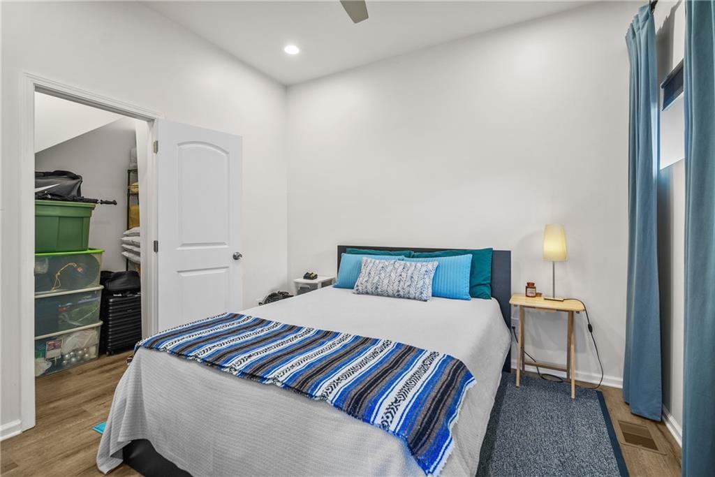 2444 Constance Street Atlanta, GA 30344 - Photo 32 of 39 a bedroom with a bed and a walk in closet