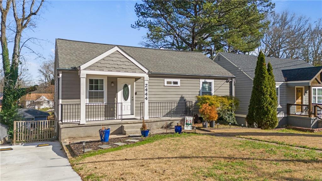 2444 Constance Street Atlanta, GA 30344 - Photo 4 of 39 a front view of a house with garden