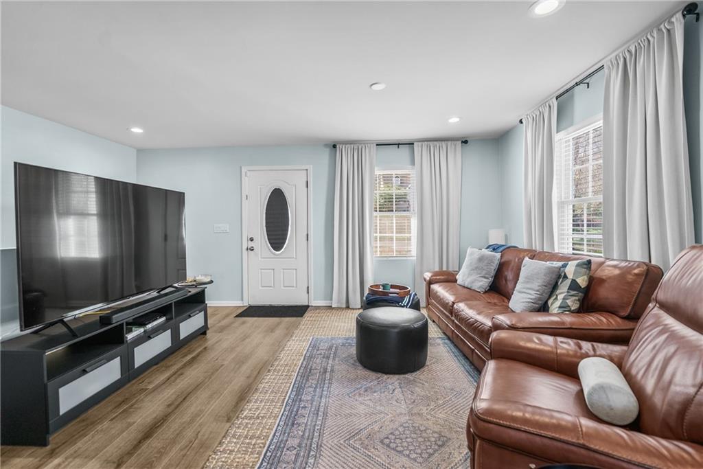 2444 Constance Street Atlanta, GA 30344 - Photo 7 of 39 a living room with furniture and a flat screen tv