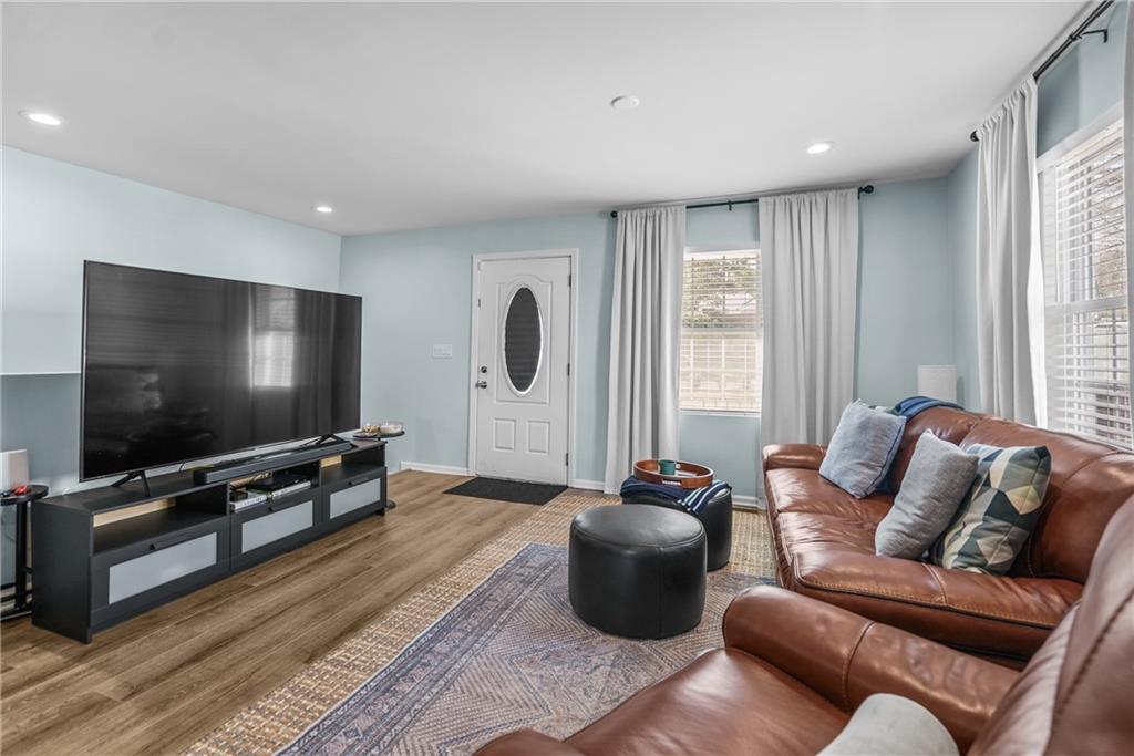 2444 Constance Street Atlanta, GA 30344 - Photo 8 of 39 a living room with furniture and a flat screen tv
