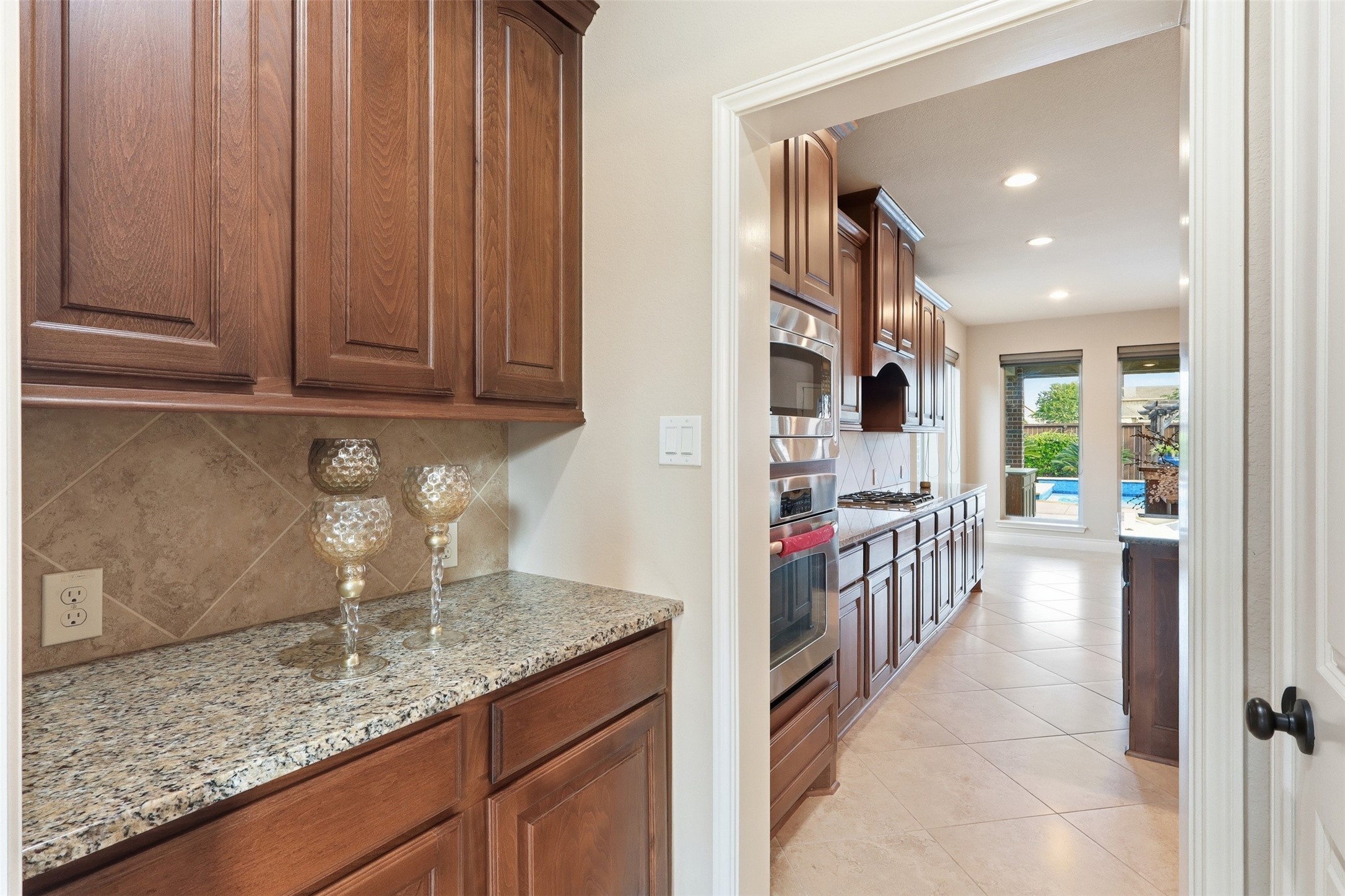 4130 Clover Ridge Lane Sugar Land, TX 77479 - Photo 11 of 48 Butler's pantry for extra storage of dishes and utensils.