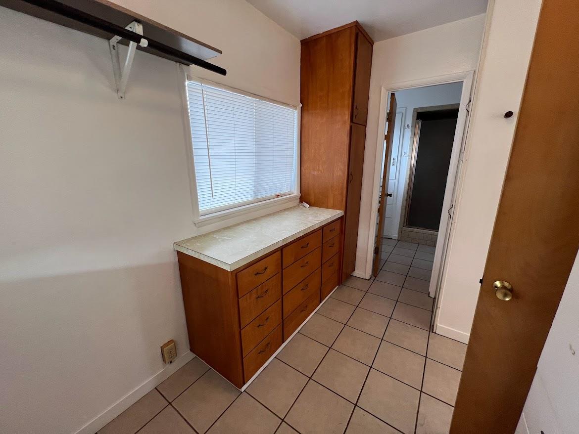 16109 East Manning Reedley, CA 93654 - Photo 12 of 30 a bathroom with a sink a mirror and a shower