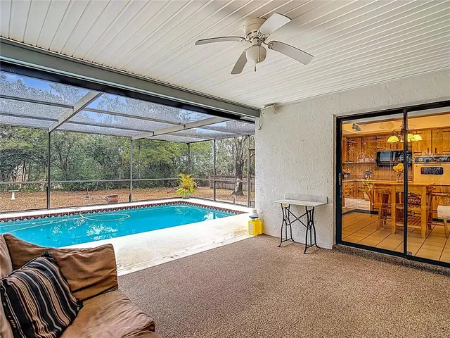 a view of swimming pool with seating space