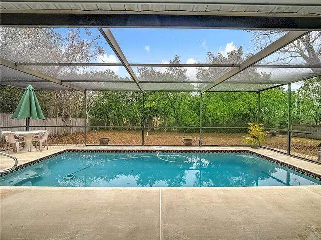 a view of a swimming pool with a patio
