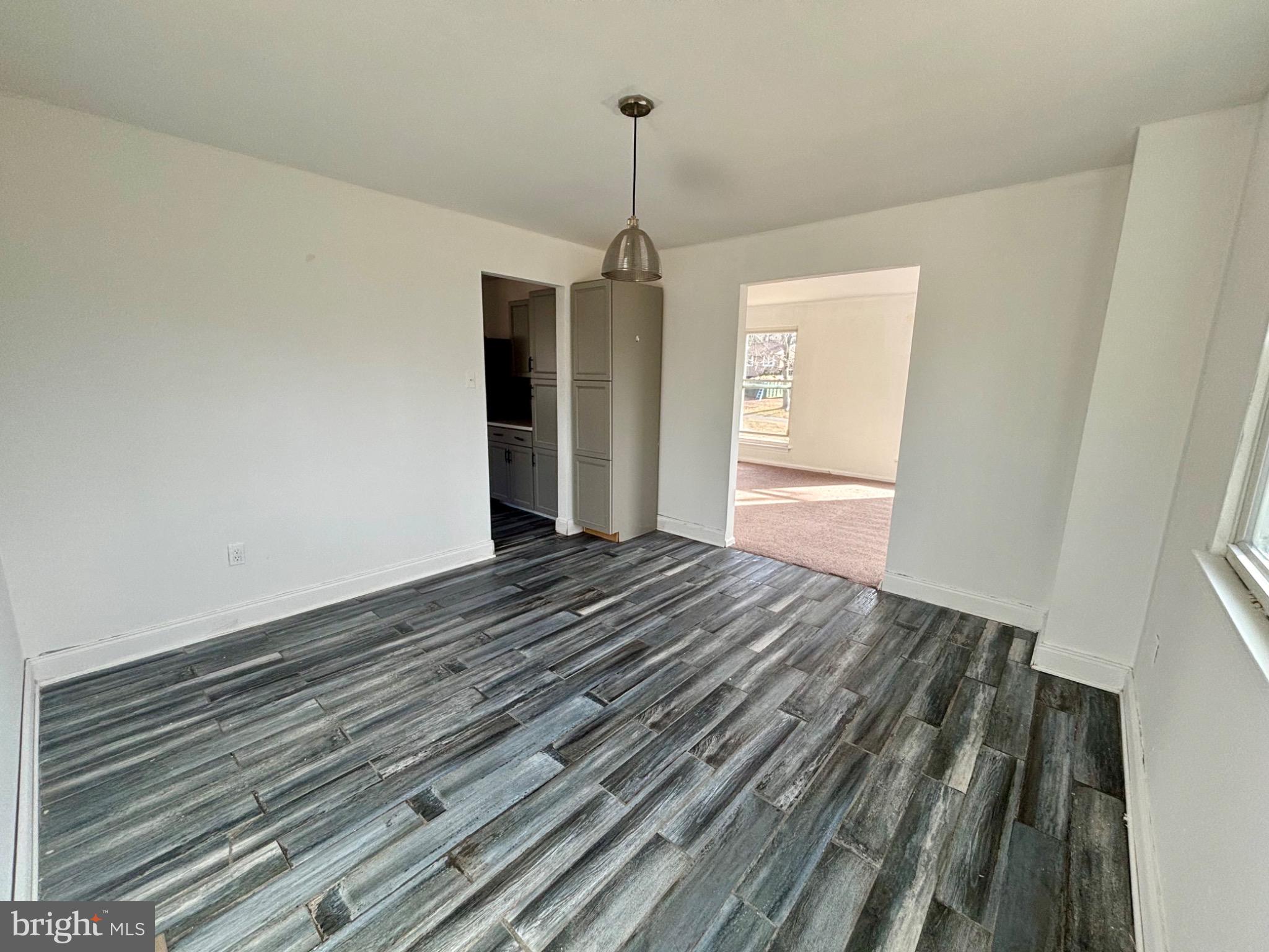 142 Oak Pines Boulevard Pemberton, NJ 08068 - Photo 3 of 17 a view of a room with wooden floor ceiling fan and window