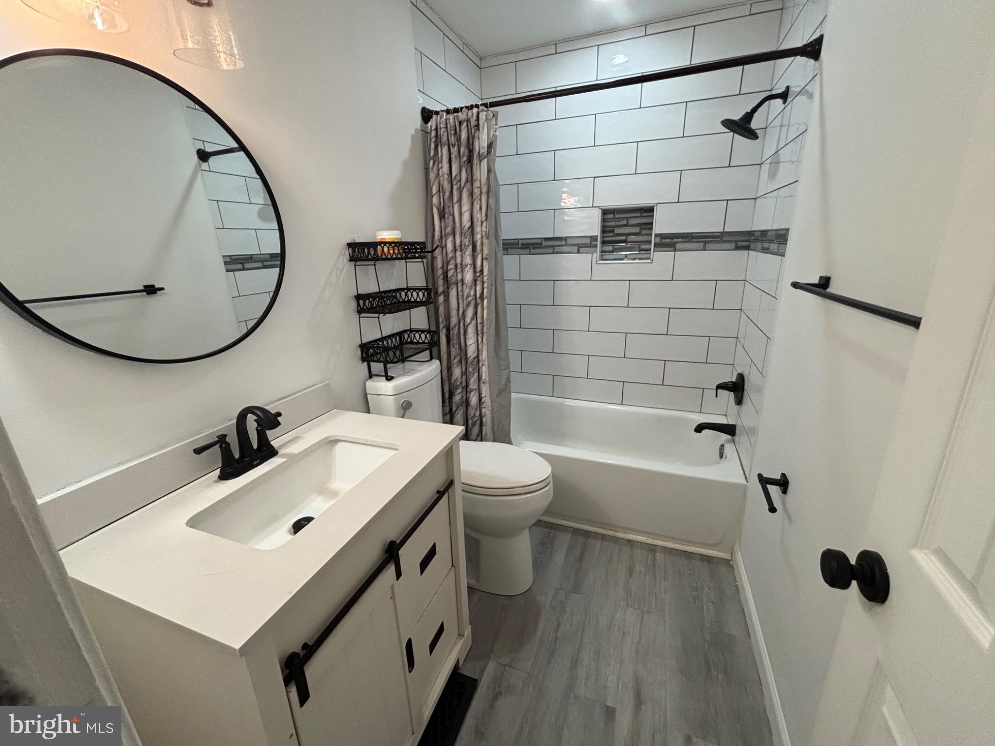 142 Oak Pines Boulevard Pemberton, NJ 08068 - Photo 6 of 17 a bathroom with a sink toilet and shower