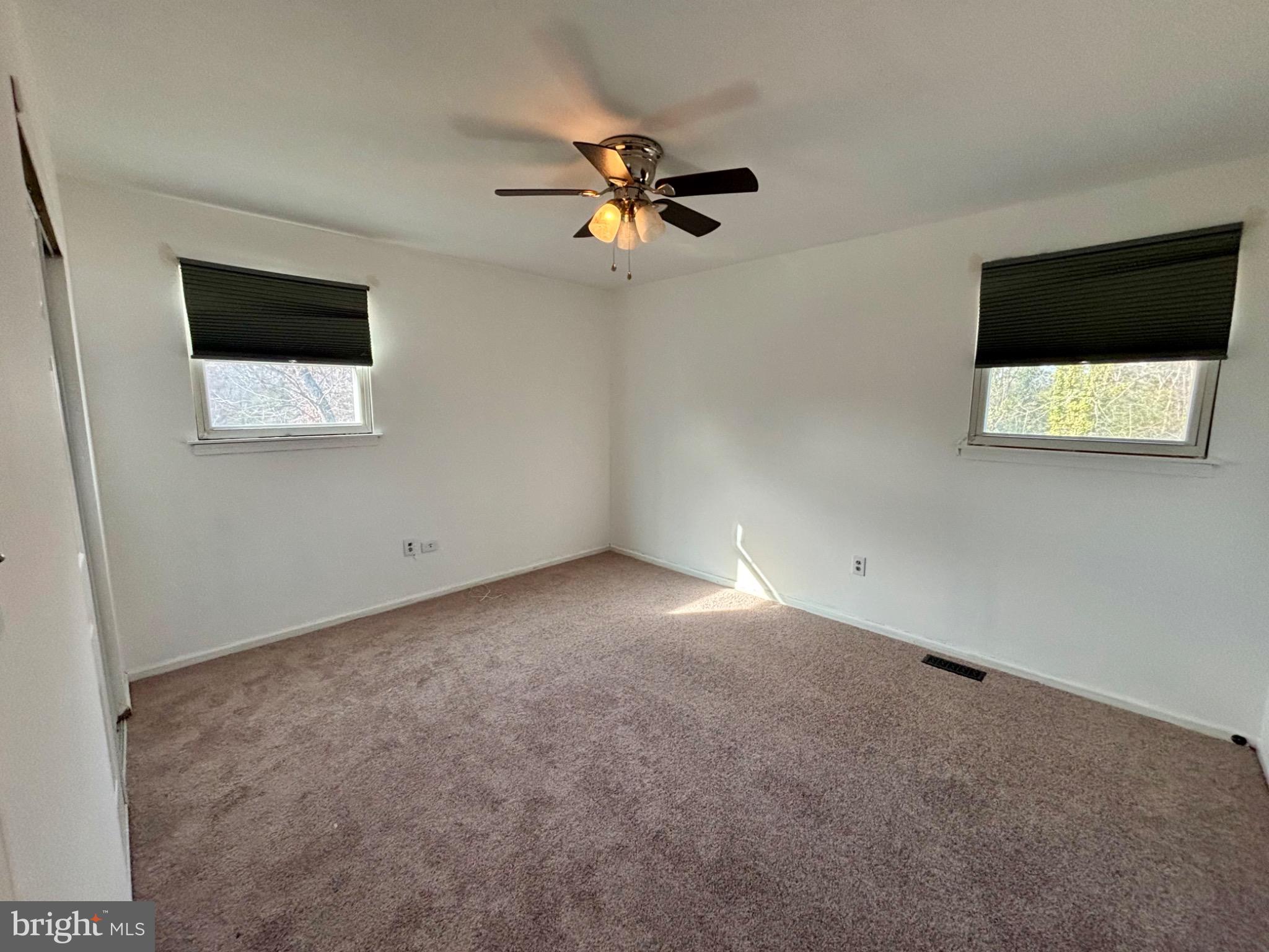 142 Oak Pines Boulevard Pemberton, NJ 08068 - Photo 7 of 17 a view of a livingroom with a ceiling fan and window