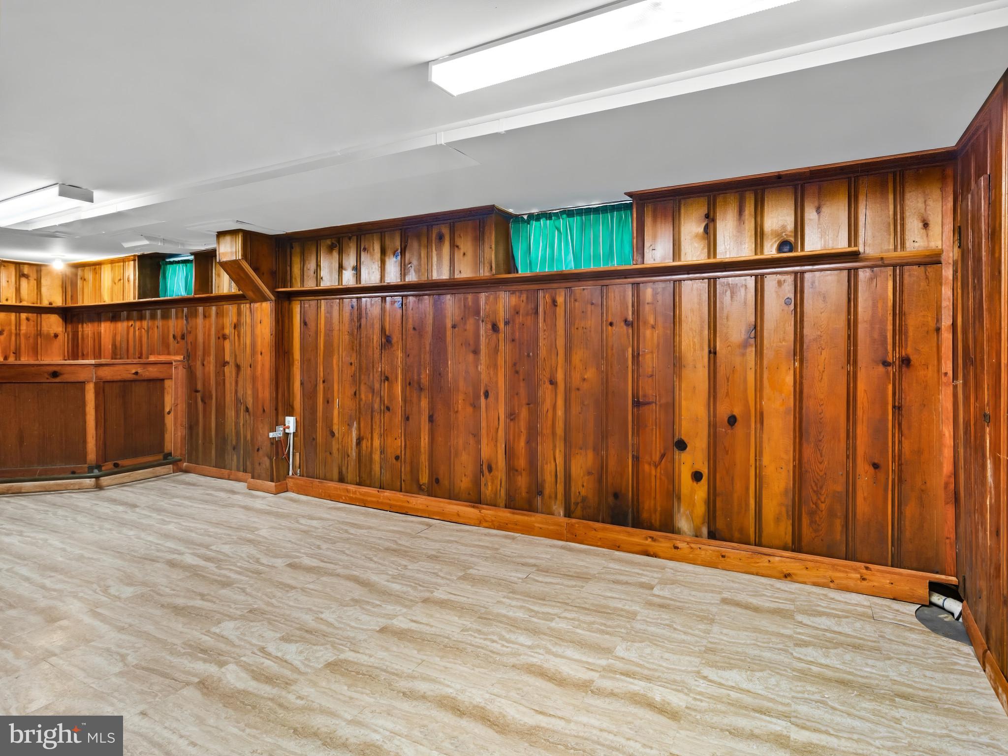 101 Upmanor Road Baltimore, MD 21229 - Photo 15 of 40 a view of an empty room with wooden floor