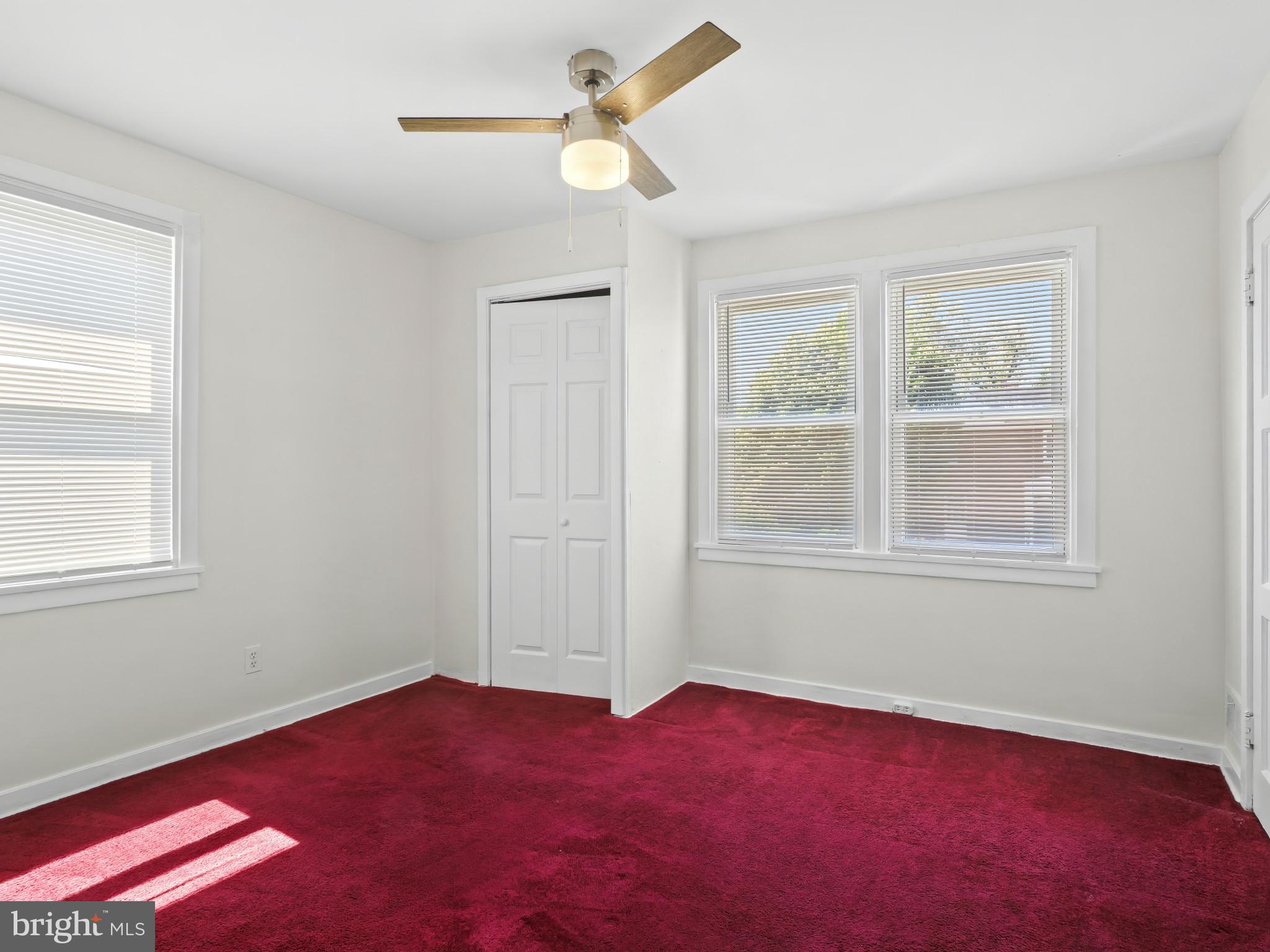 101 Upmanor Road Baltimore, MD 21229 - Photo 17 of 40 an empty room with a window and a fan