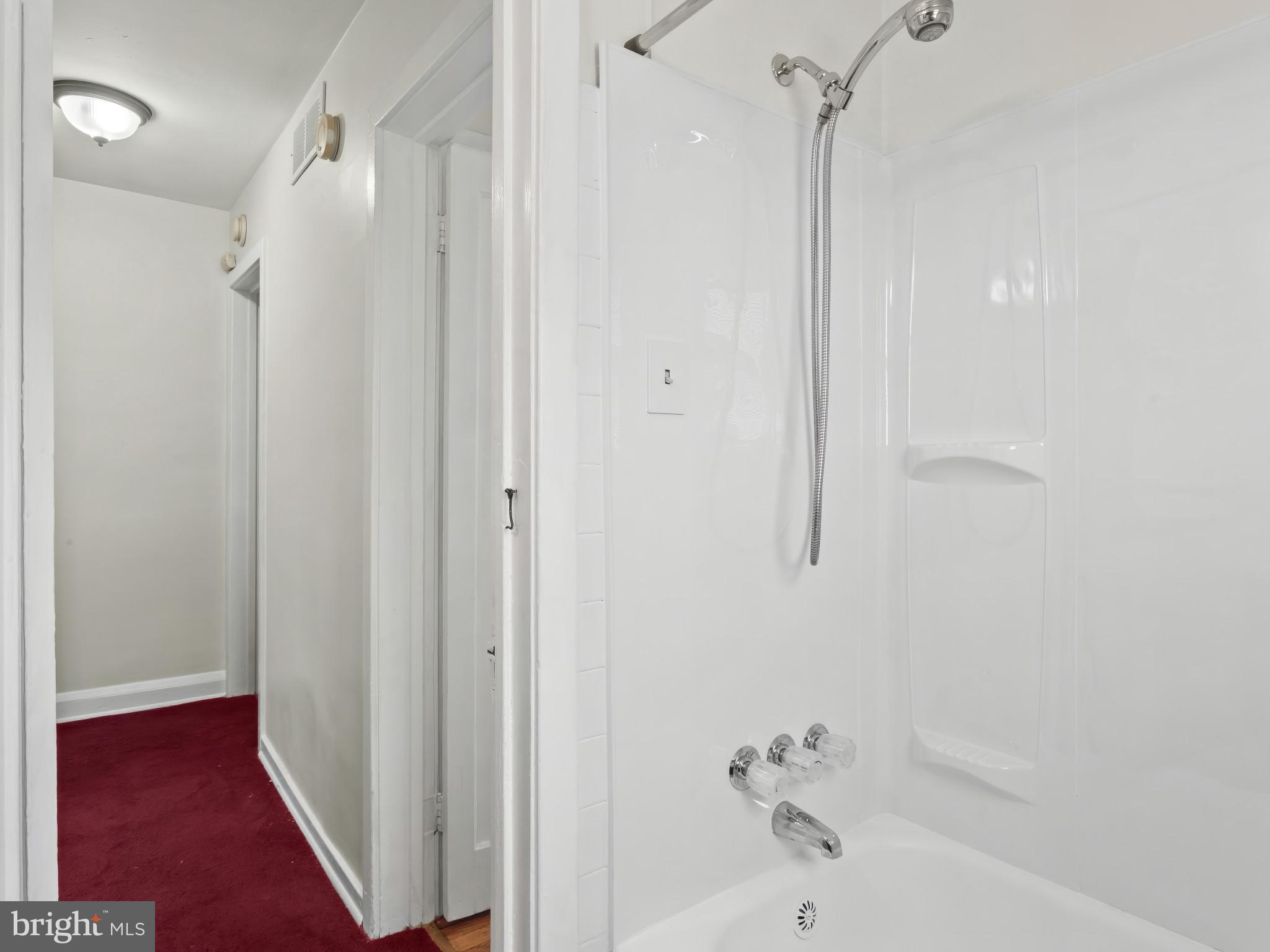 101 Upmanor Road Baltimore, MD 21229 - Photo 20 of 40 a bathroom with a bathtub and a shower