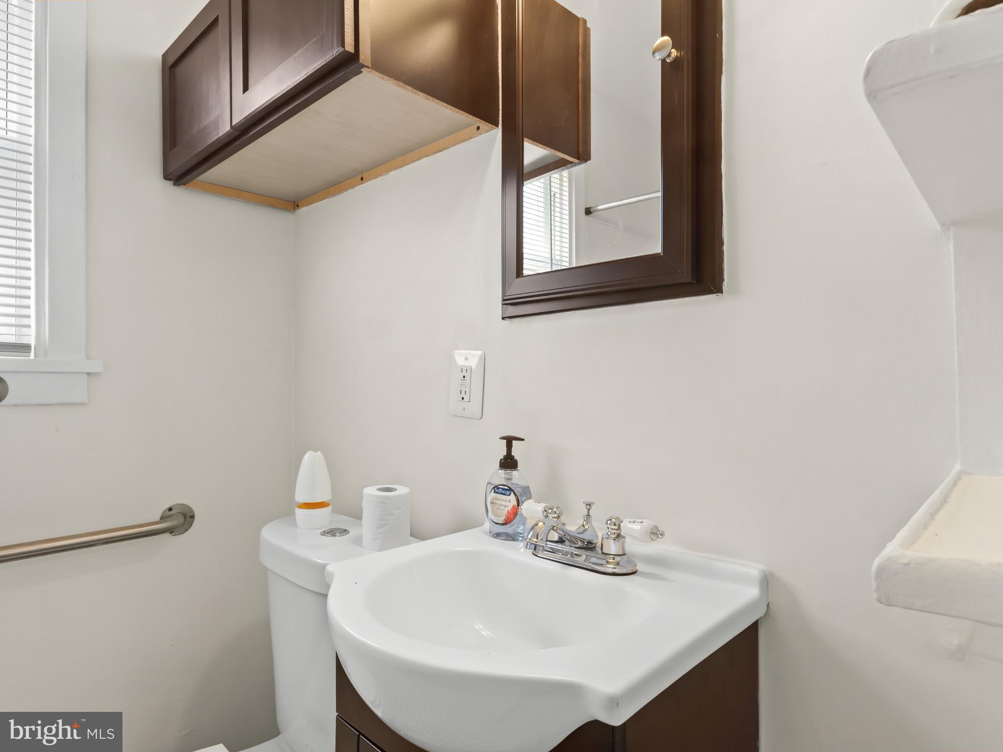 101 Upmanor Road Baltimore, MD 21229 - Photo 21 of 40 a bathroom with a sink and a mirror