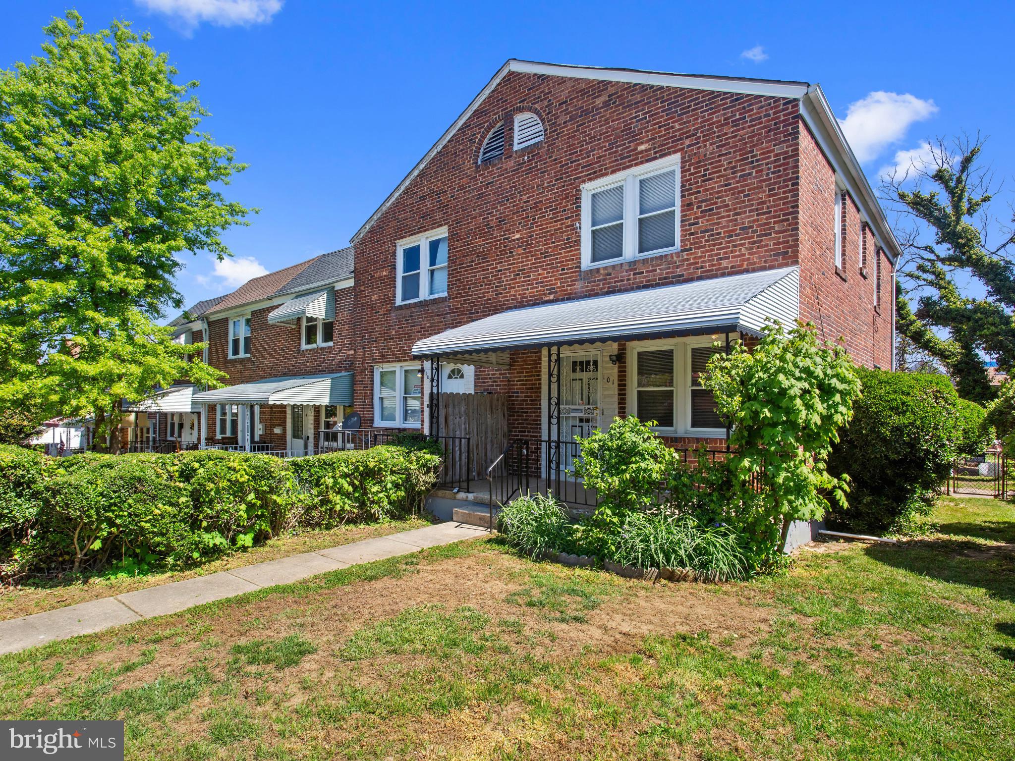 101 Upmanor Road Baltimore, MD 21229 - Photo 3 of 40 a front view of a house with a yard