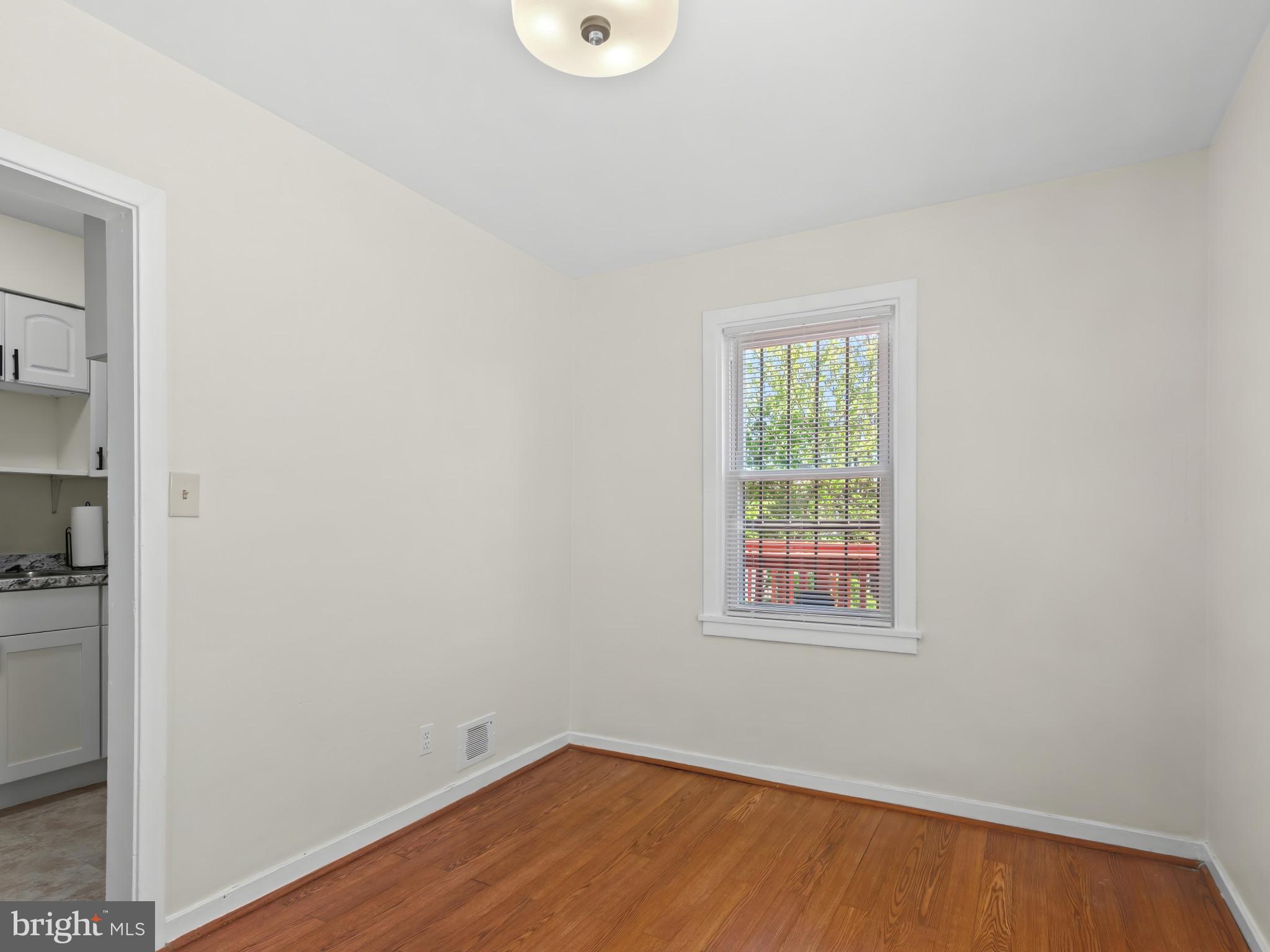 101 Upmanor Road Baltimore, MD 21229 - Photo 8 of 40 an empty room with a window