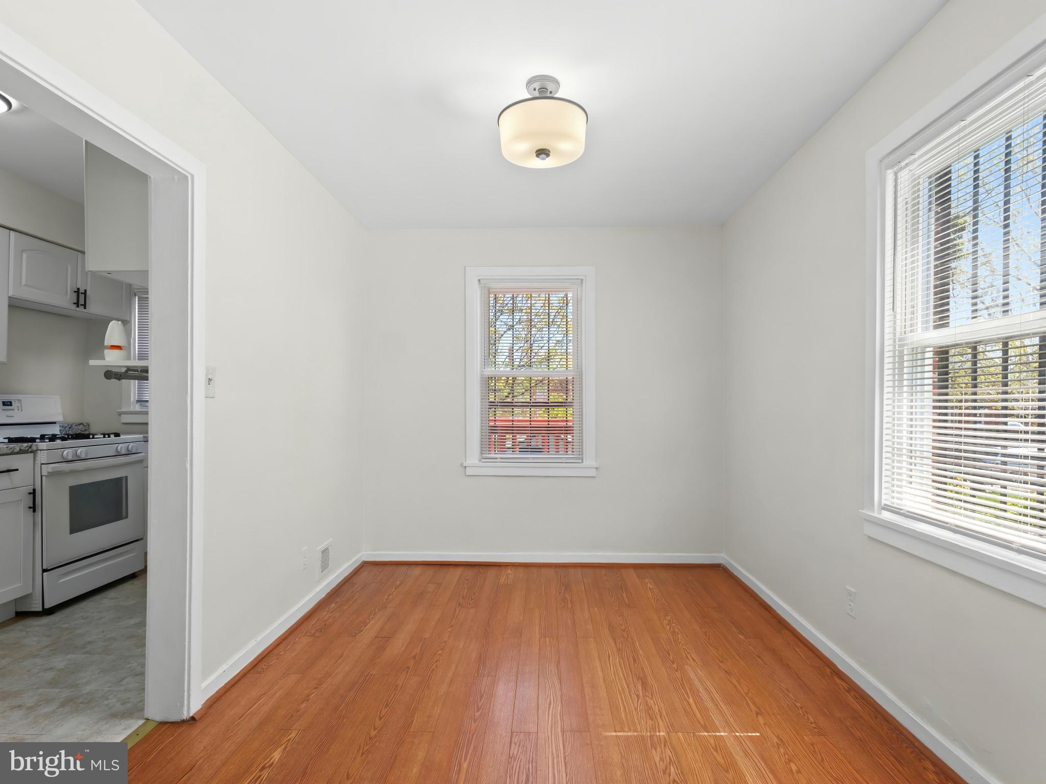 101 Upmanor Road Baltimore, MD 21229 - Photo 9 of 40 a view of a room with wooden floor and electronic appliances