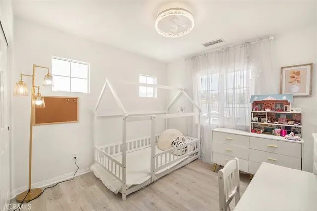 a bedroom with furniture and a window