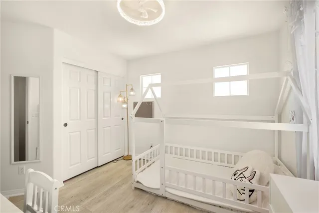 a view of staircase with white walls and white wooden floor