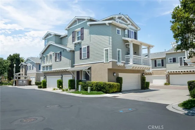 a view of multiple houses with a street