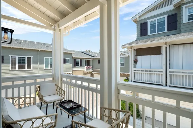a view of a balcony with chairs
