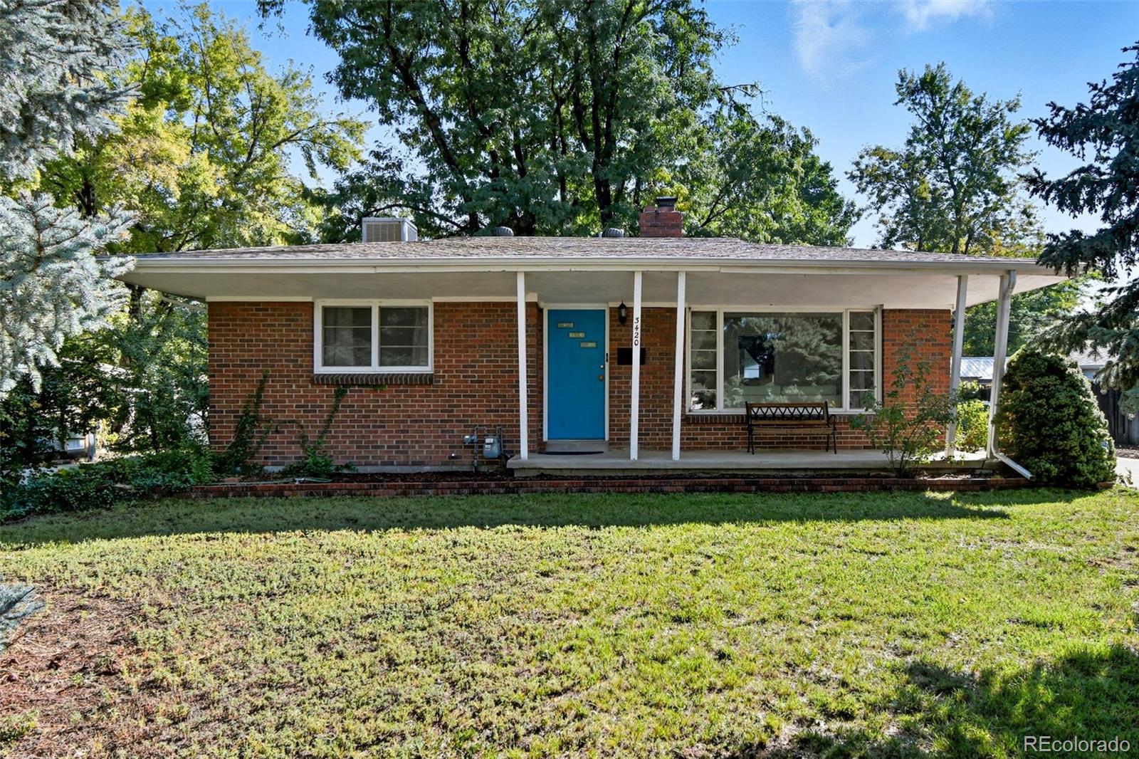 front view of a house with a yard