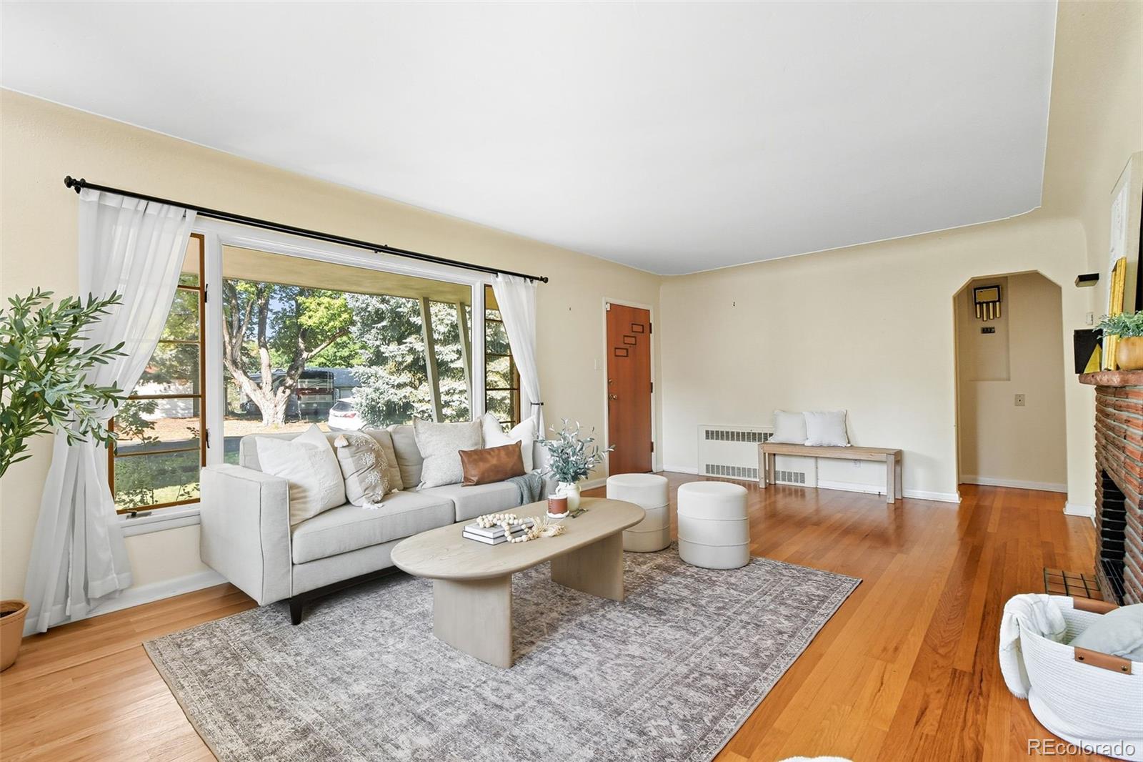 3420 Otis Street Wheat Ridge, CO 80033 - Photo 11 of 32 a living room with furniture and a large window