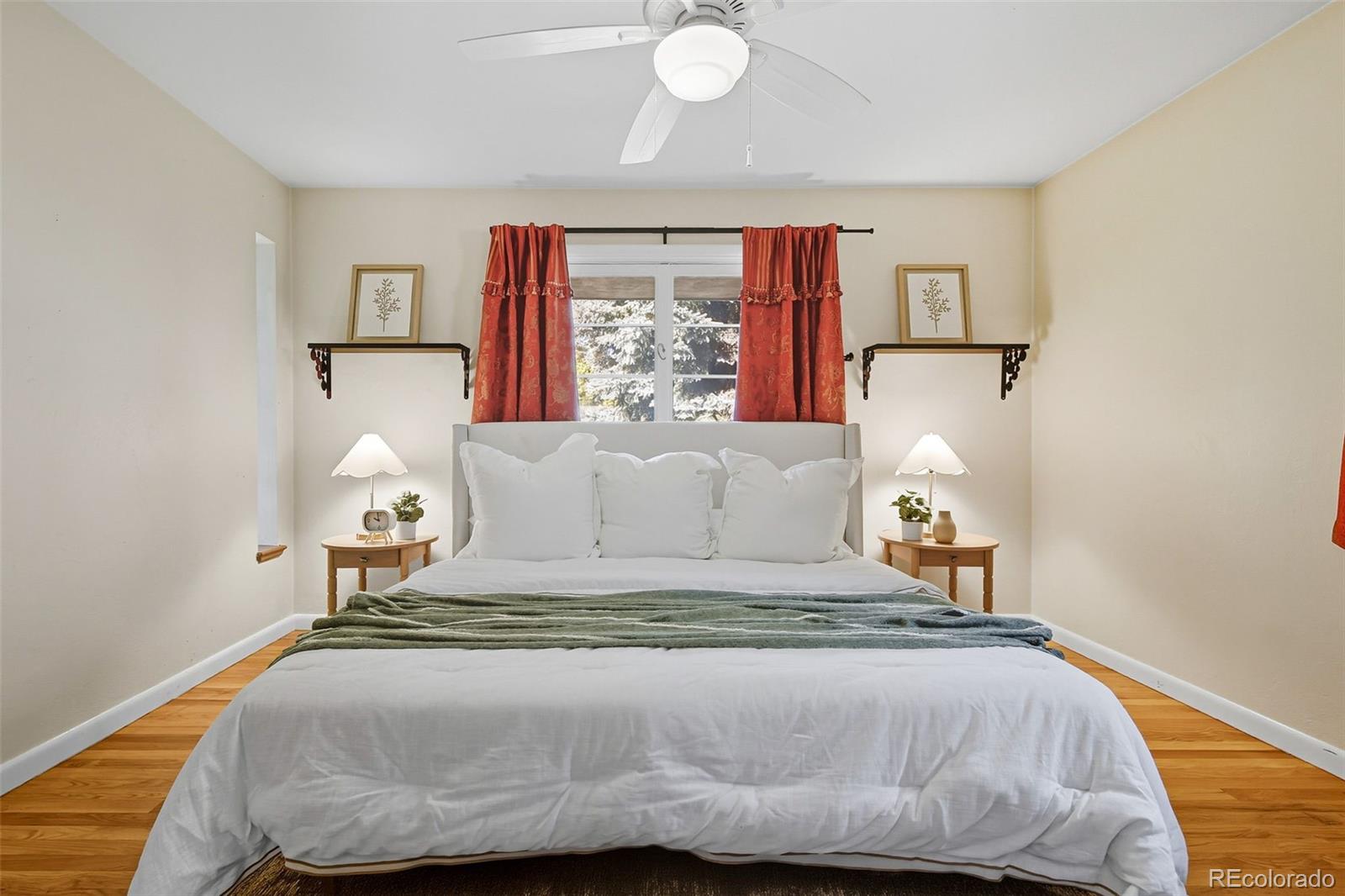 3420 Otis Street Wheat Ridge, CO 80033 - Photo 20 of 32 a bedroom with a bed and window