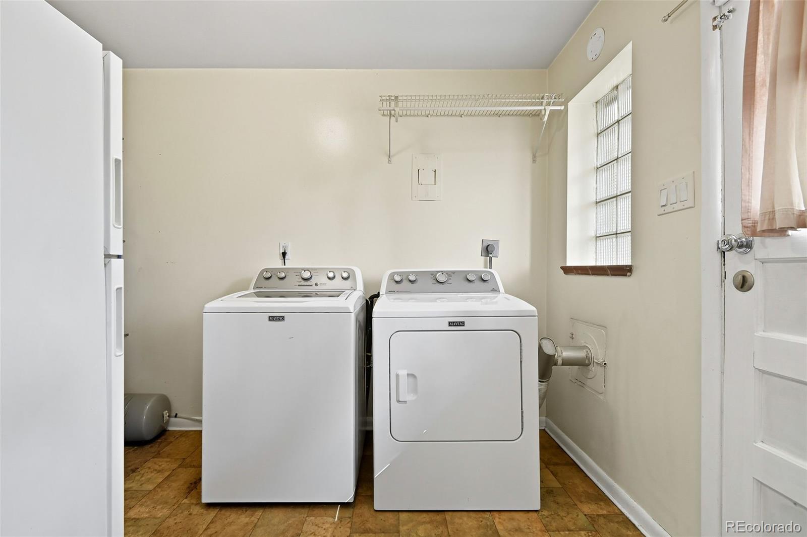 3420 Otis Street Wheat Ridge, CO 80033 - Photo 26 of 32 a utility room with dryer and washer