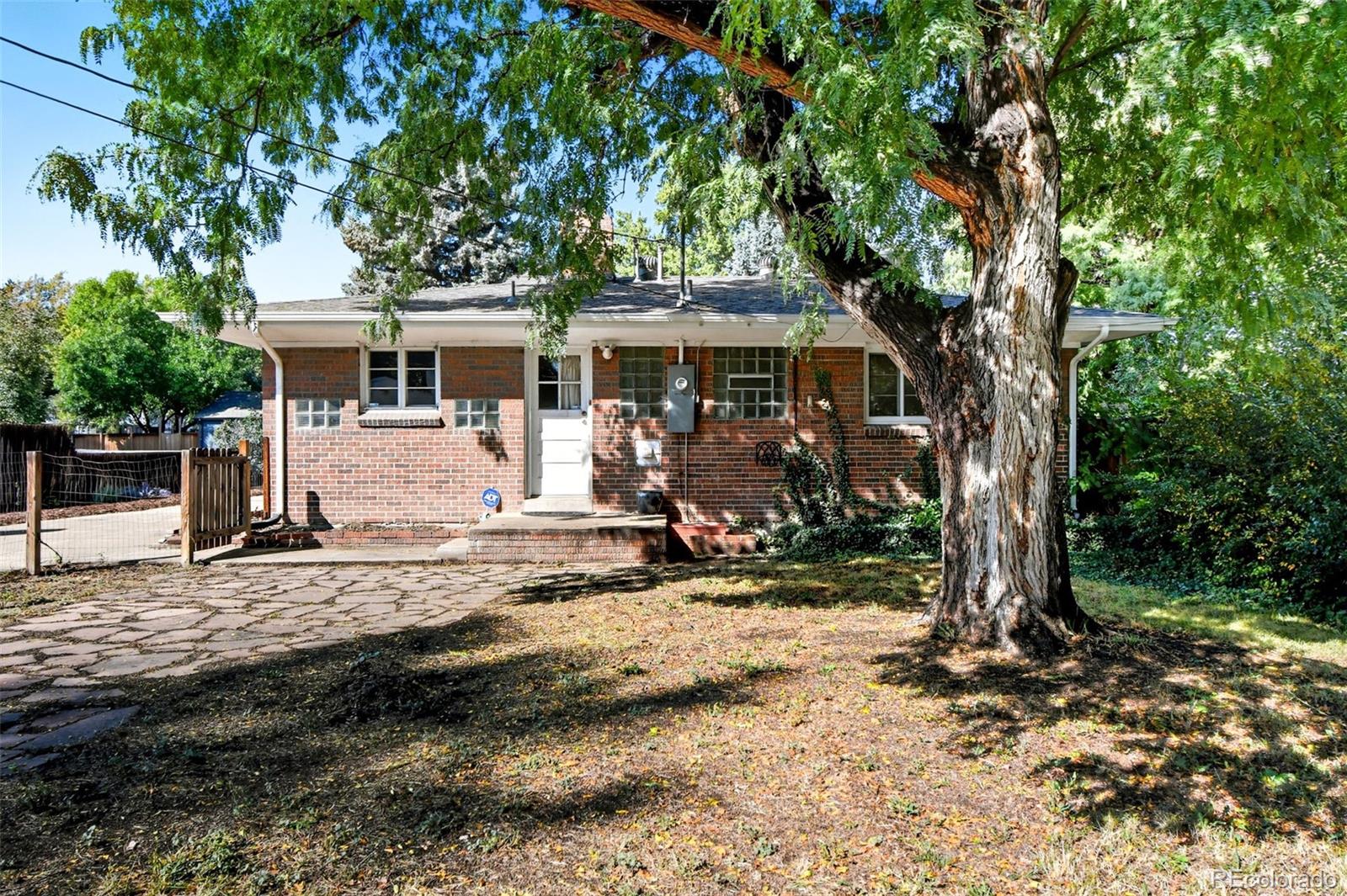 3420 Otis Street Wheat Ridge, CO 80033 - Photo 29 of 32 a view of a house with backyard