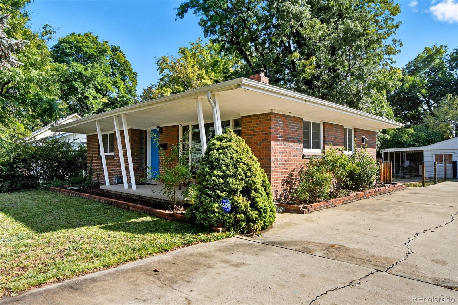 3420 Otis Street Wheat Ridge, CO 80033 - Photo 4 of 32 a front view of house with yard and green space