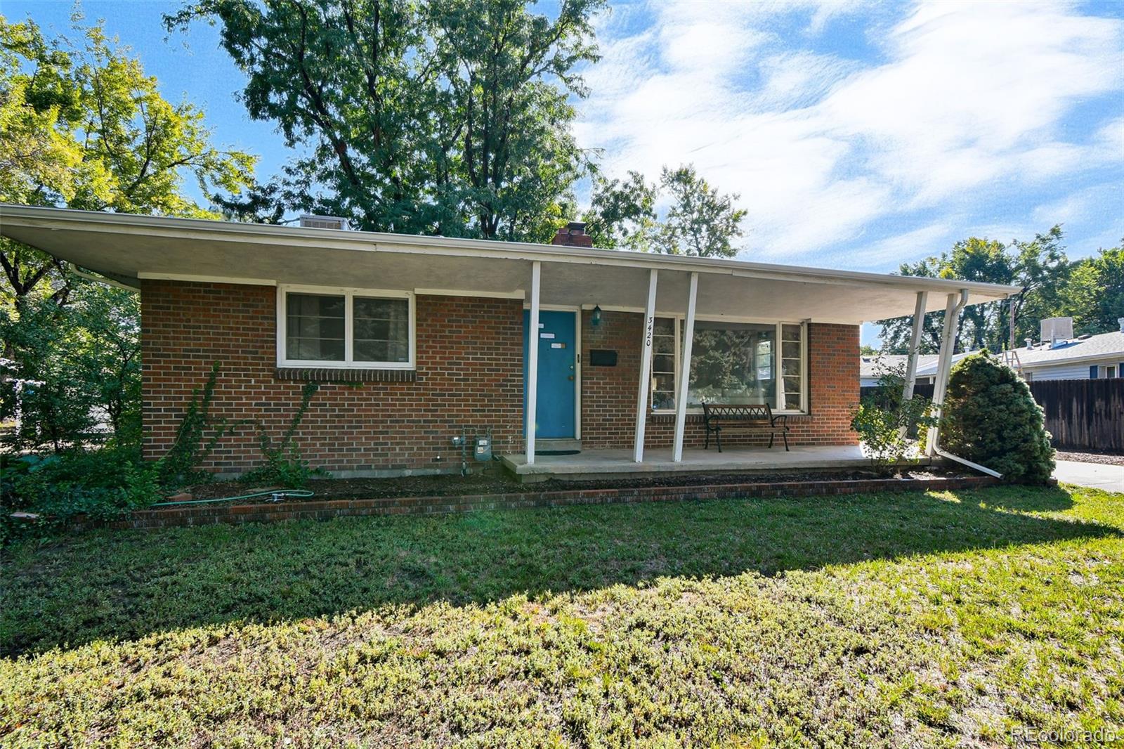 3420 Otis Street Wheat Ridge, CO 80033 - Photo 5 of 32 a view of a house with a yard