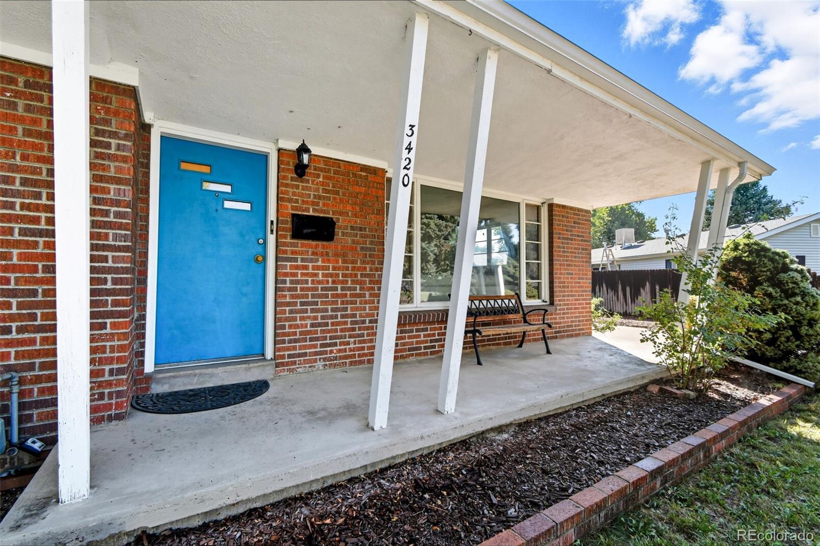 3420 Otis Street Wheat Ridge, CO 80033 - Photo 7 of 32 a view of front door of house