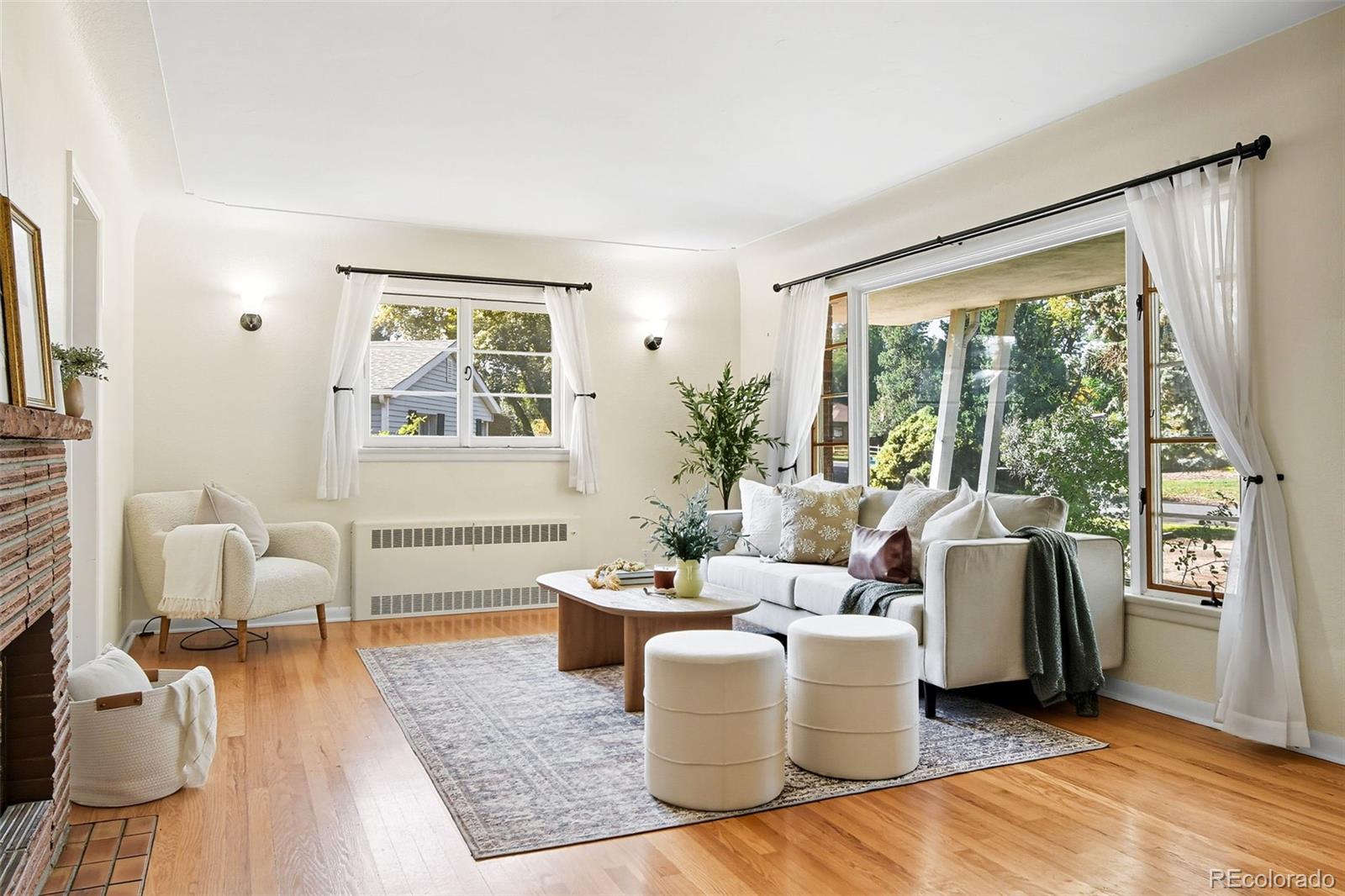 3420 Otis Street Wheat Ridge, CO 80033 - Photo 10 of 32 a living room with furniture and a large window