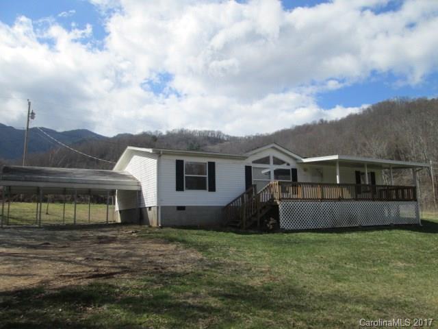 136 Asbury Road Canton, NC 28716 - Photo 1 of 24 a view of a house with backyard and garden