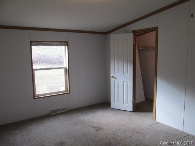 136 Asbury Road Canton, NC 28716 - Photo 16 of 24 an empty room with windows