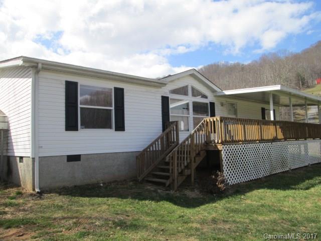 136 Asbury Road Canton, NC 28716 - Photo 3 of 24 a view of house with a yard