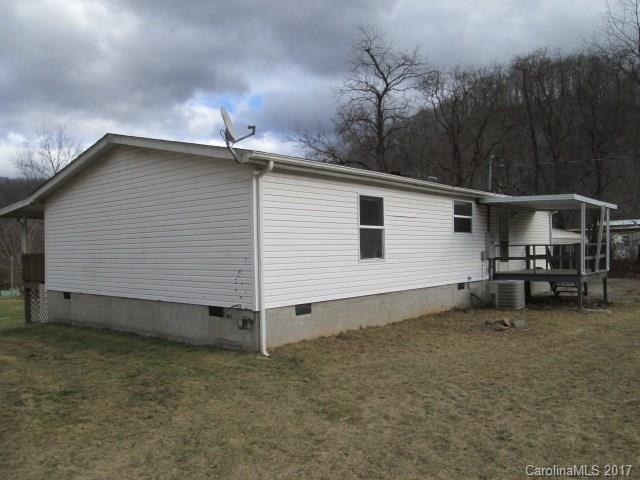 136 Asbury Road Canton, NC 28716 - Photo 4 of 24 a view of a house with a yard and sitting area