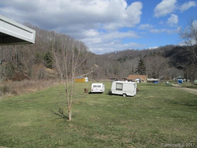 136 Asbury Road Canton, NC 28716 - Photo 6 of 24 a view of a grassy area with an trees