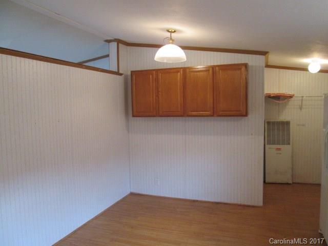 136 Asbury Road Canton, NC 28716 - Photo 8 of 24 a view of an empty room with a window