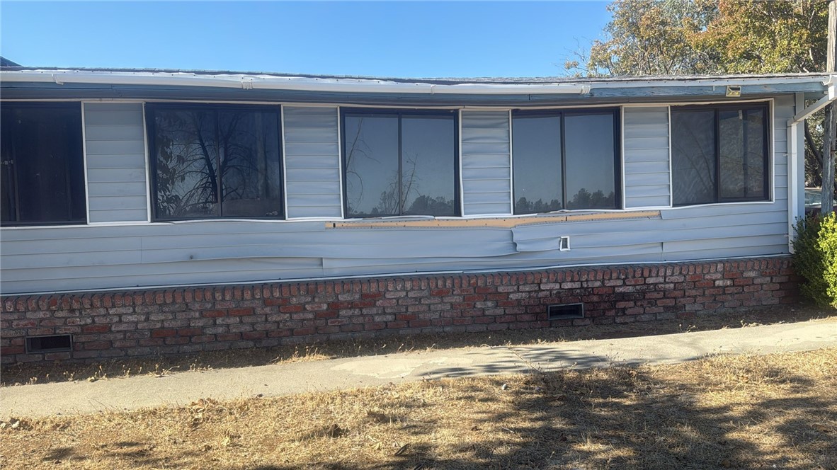 15702 Stagecoach Road Corning, CA 96021 - Photo 14 of 18 a view of a house with a yard
