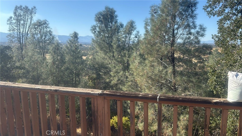 15702 Stagecoach Road Corning, CA 96021 - Photo 2 of 18 a balcony with wooden fence