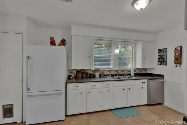 a kitchen with a sink and cabinets