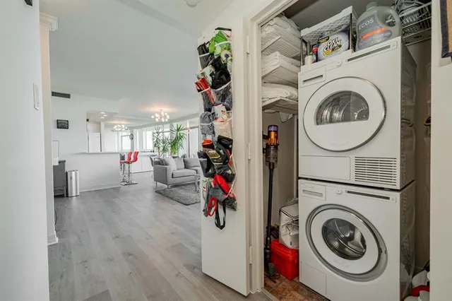 a view of a storage and utility room with washer and dryer