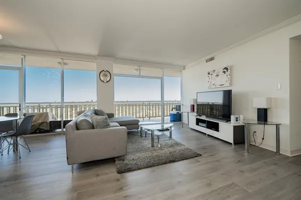 a living room with furniture and a large window