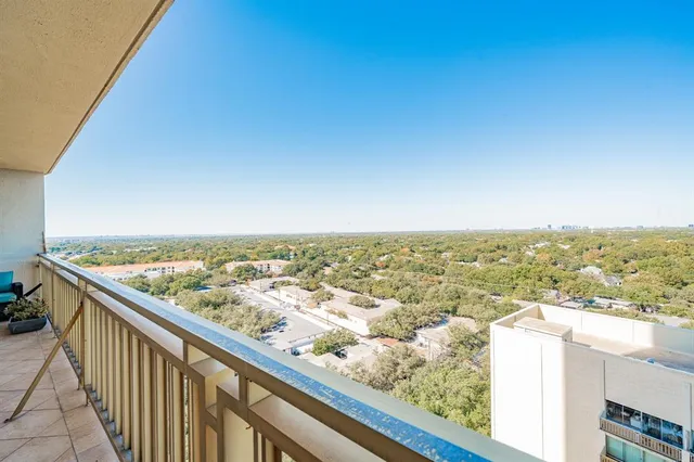 an aerial view of residential building and ocean view