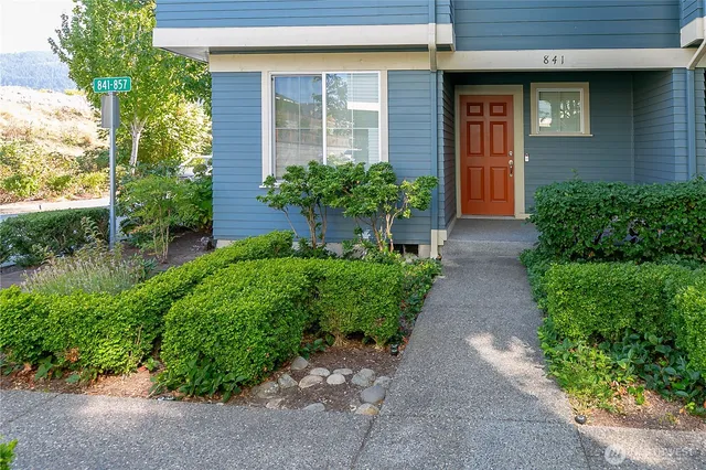 a view of a pathway besides a house