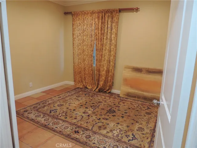 a view of a door with wooden floor